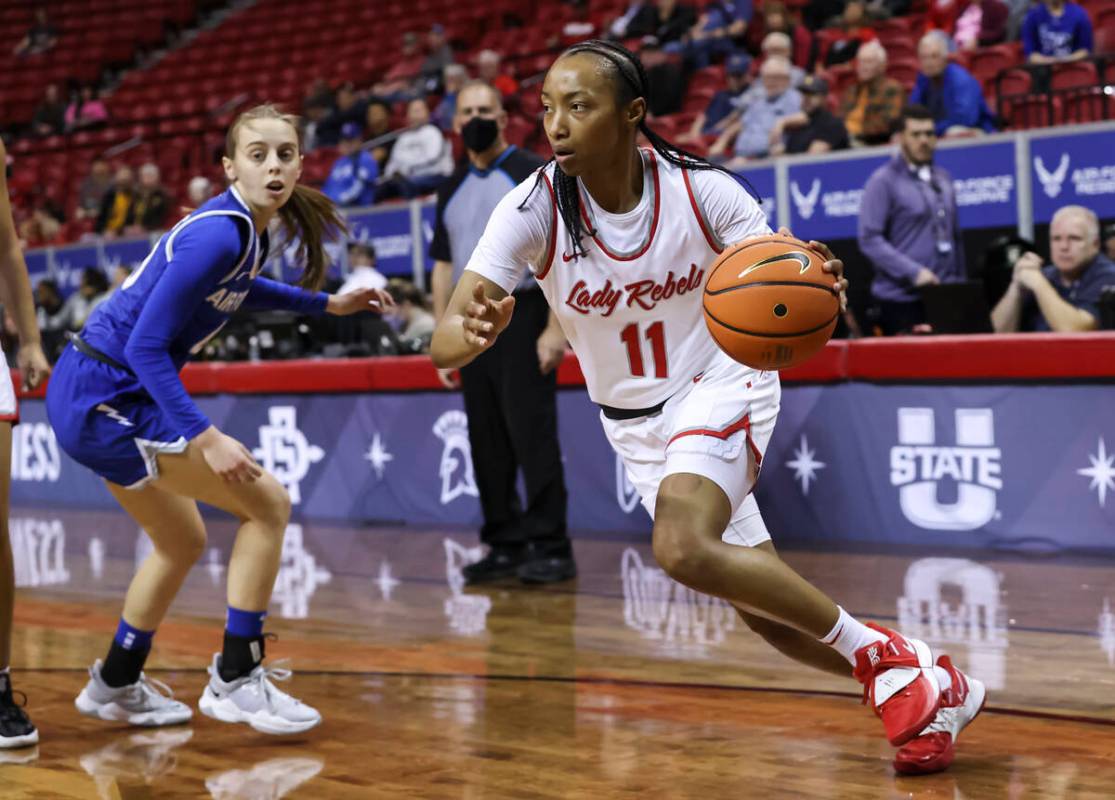 UNLV Lady Rebels guard Justice Ethridge (11) drives to the basket against the Air Force Falcons ...