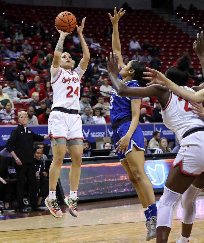 UNLV Lady Rebels guard Essence Booker (24) shoots as Air Force Falcons guard Cierra Winters (3) ...