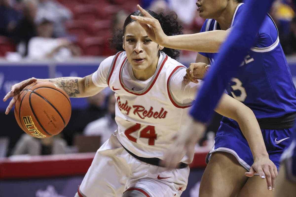 UNLV Lady Rebels guard Essence Booker (24) drives to the basket against Air Force Falcons guard ...