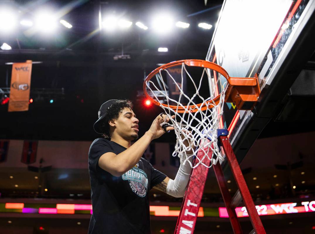 Las Vegas native and Gonzaga Bulldogs guard Julian Strawther cuts down the net after beating St ...