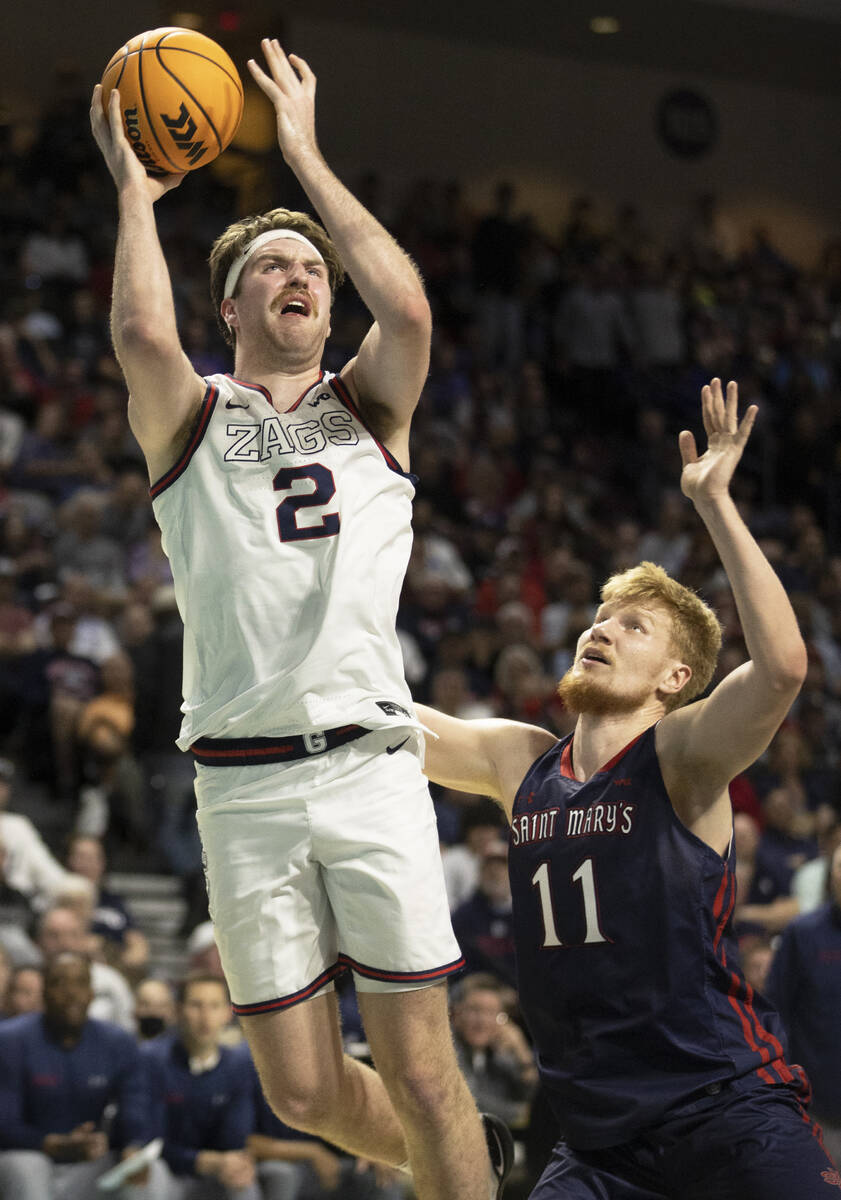 Gonzaga Bulldogs forward Drew Timme (2) shoots over St. Mary's Gaels forward Matthias Tass (11) ...