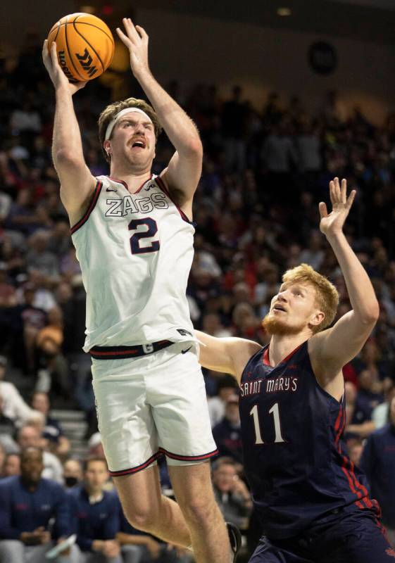 Gonzaga Bulldogs forward Drew Timme (2) shoots over St. Mary's Gaels forward Matthias Tass (11) ...