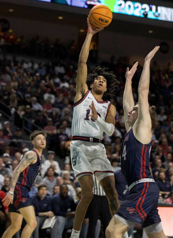 Gonzaga Bulldogs guard Hunter Sallis (10) shoots over St. Mary's Gaels guard Alex Ducas (44) in ...