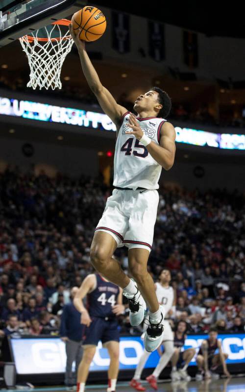 Gonzaga Bulldogs guard Rasir Bolton (45) slices to the rim past St. Mary's Gaels guard Alex Duc ...