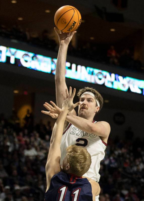 Gonzaga Bulldogs forward Drew Timme (2) shoots over St. Mary's Gaels forward Matthias Tass (11) ...