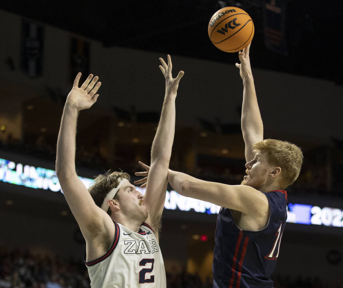 St. Mary's Gaels forward Matthias Tass (11) shoots over Gonzaga Bulldogs forward Drew Timme (2) ...