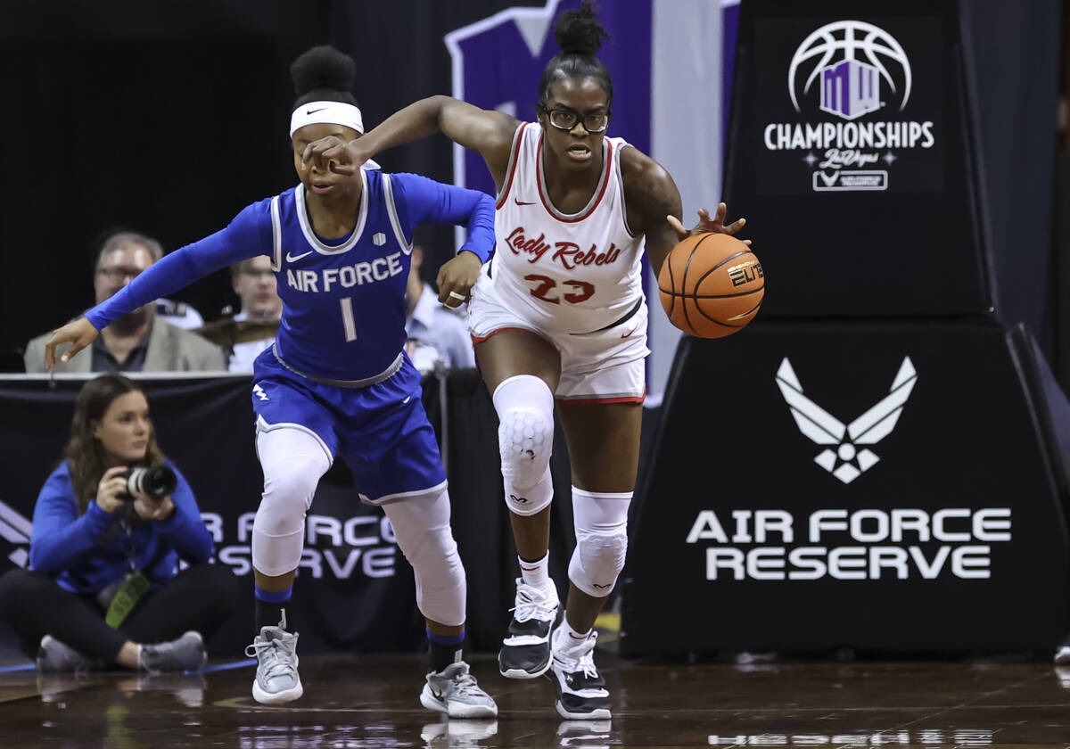 UNLV Lady Rebels center Desi-Rae Young (23) brings the ball up court past Air Force Falcons gua ...