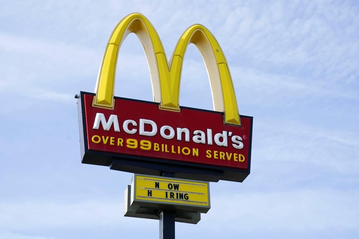 A sign is displayed outside a McDonald's restaurant in April 2021 in Des Moines, Iowa. (AP Pho ...