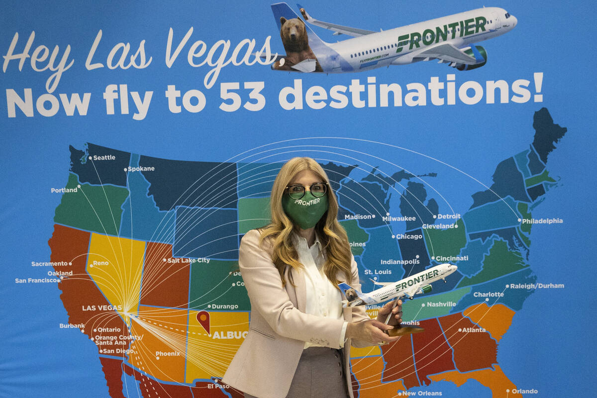 Frontier Airlines Vice President of Marketing Tyri Squyres, left, and Harry Reid International ...