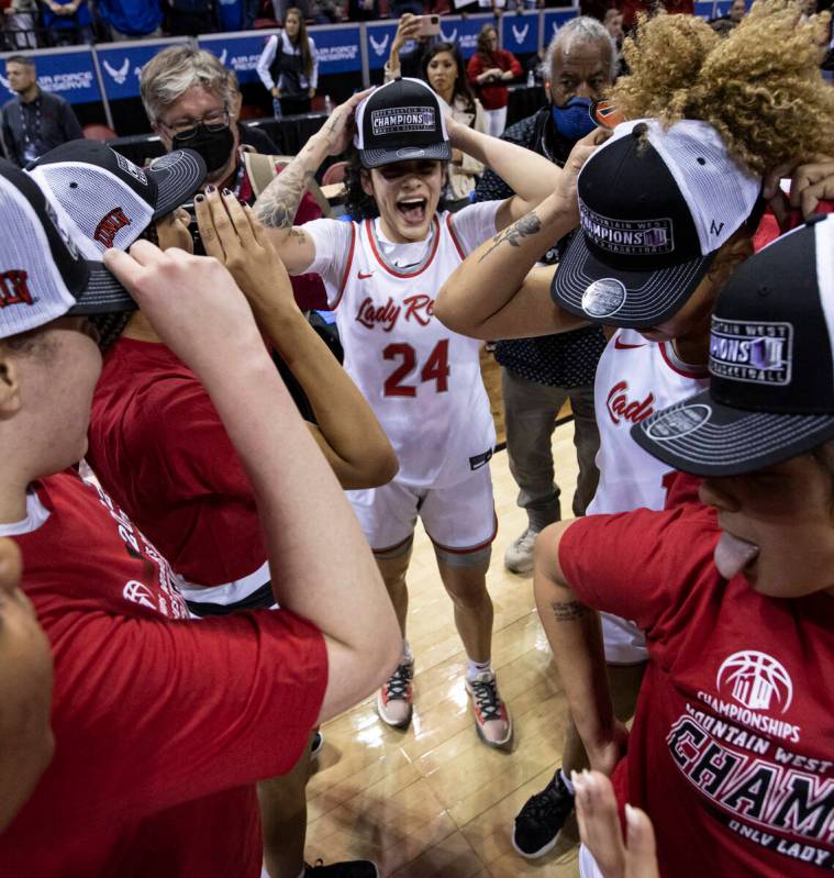 UNLV Lady Rebels guard Essence Booker (24) celebrates with teammates after defeating the Colora ...