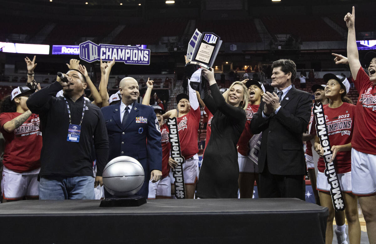 UNLV Lady Rebels head coach Lindy La Rocque raises the championship trophy after defeating the ...