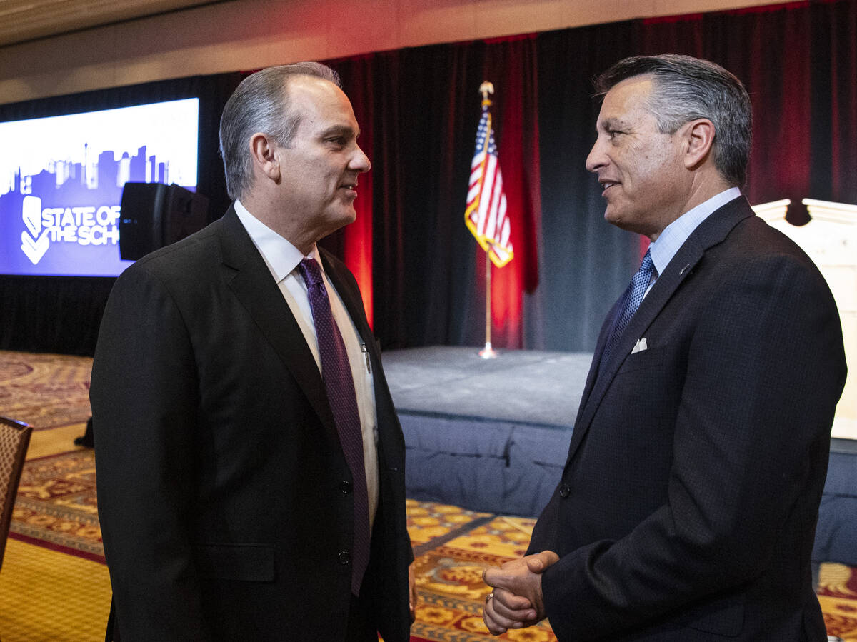 Clark County School District (CCSD) Superintendent Dr. Jesus Jara, left, chats with Brian Sando ...