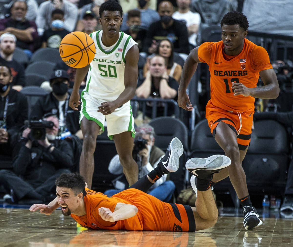Oregon State Beavers guard Jarod Lucas (2) looks up after losing the ball while trailed by team ...