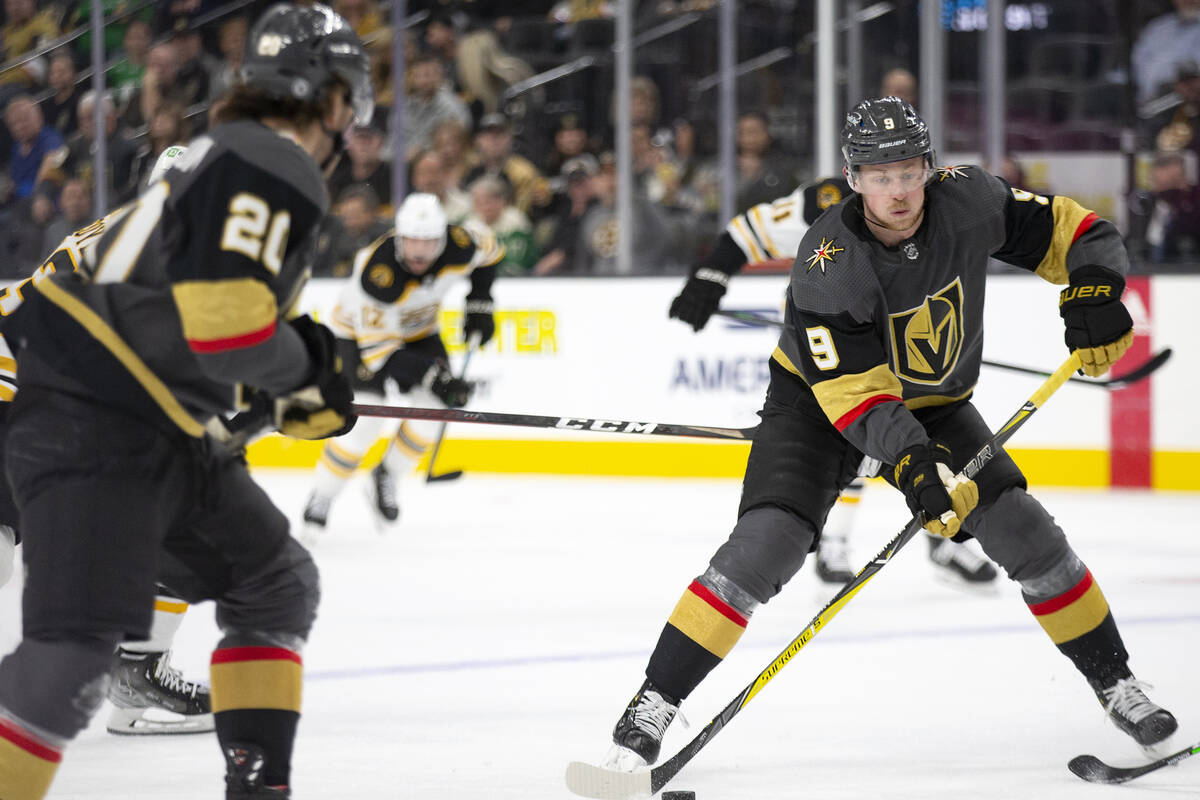 Golden Knights center Jack Eichel (9) looks to pass while center Chandler Stephenson (20) skate ...