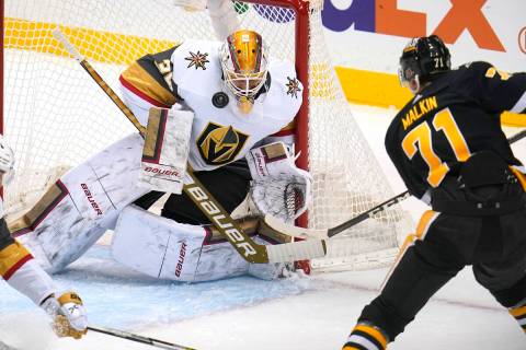 Vegas Golden Knights goaltender Laurent Brossoit (39) blocks a shot by Pittsburgh Penguins' Evg ...