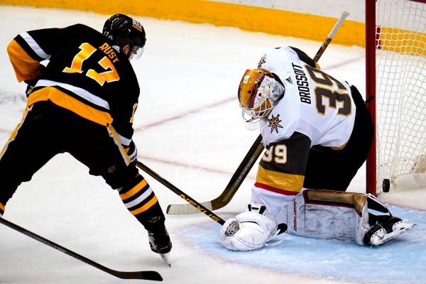 Vegas Golden Knights goaltender Laurent Brossoit (39) blocks a shot by Pittsburgh Penguins' Bry ...