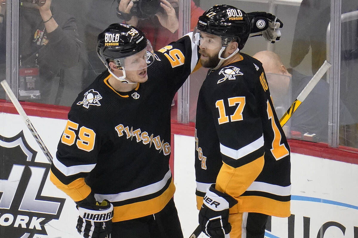 Pittsburgh Penguins' Bryan Rust (17) celebrates his goal with Jake Guentzel during the third pe ...