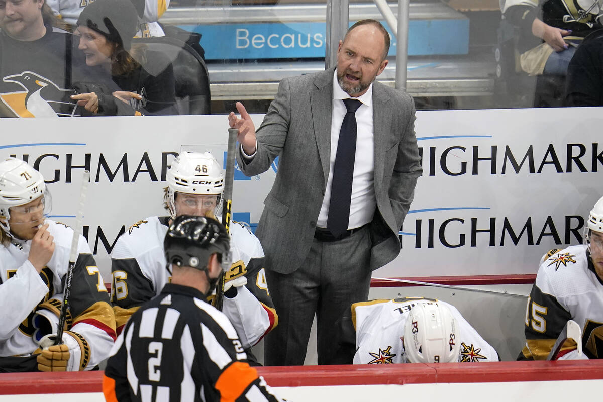 Vegas Golden Knights head coach Peter DeBoer has a work with referee Jon McIsaac (2) during the ...
