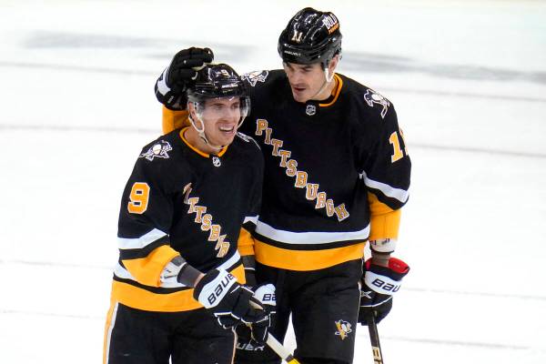 Pittsburgh Penguins' Evan Rodrigues (9) celebrates with Brian Boyle after scoring an empty-net ...