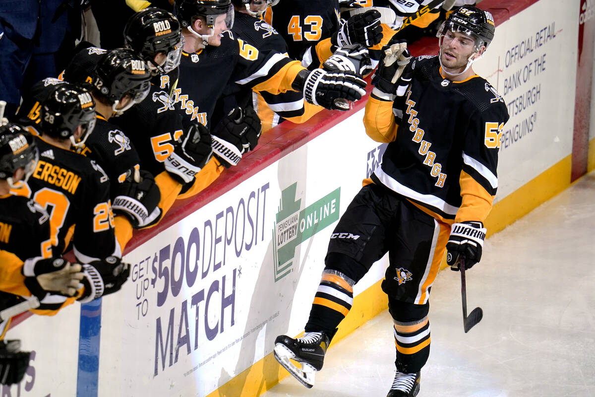Pittsburgh Penguins' Mark Friedman (52) returns to the bench after scoring during the third per ...