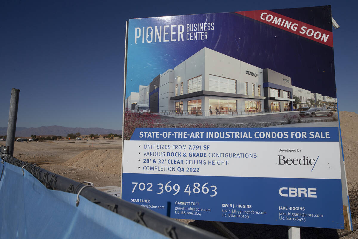 Signage at a construction site where Canadian developer Beedie is underway on a two-building in ...