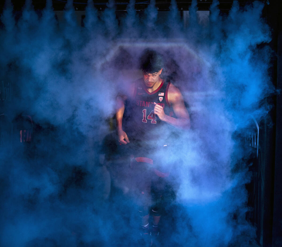 Stanford Cardinal forward Spencer Jones (14) emerges from the smoke as he’s introduced to pla ...