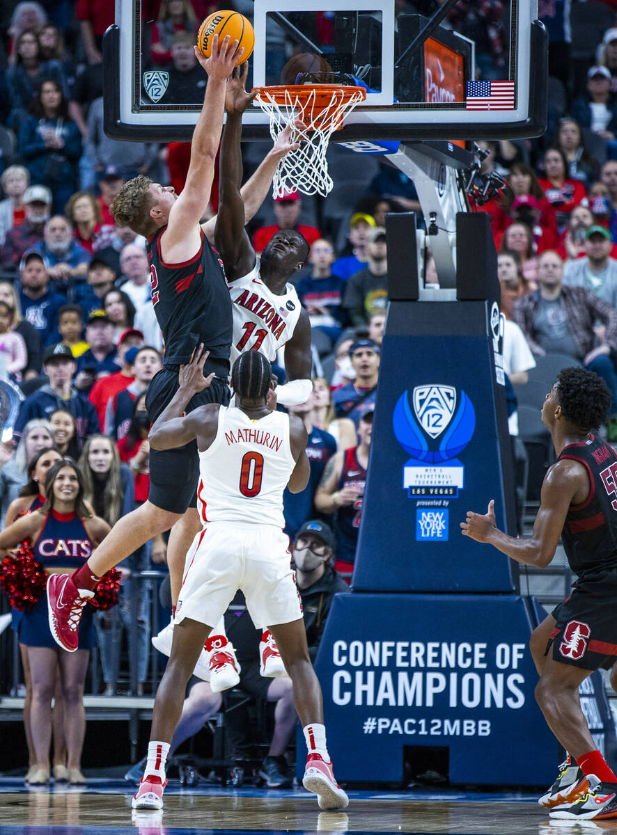 Stanford Cardinal forward James Keefe (22) goes up strong to the net defended by Arizona Wildca ...