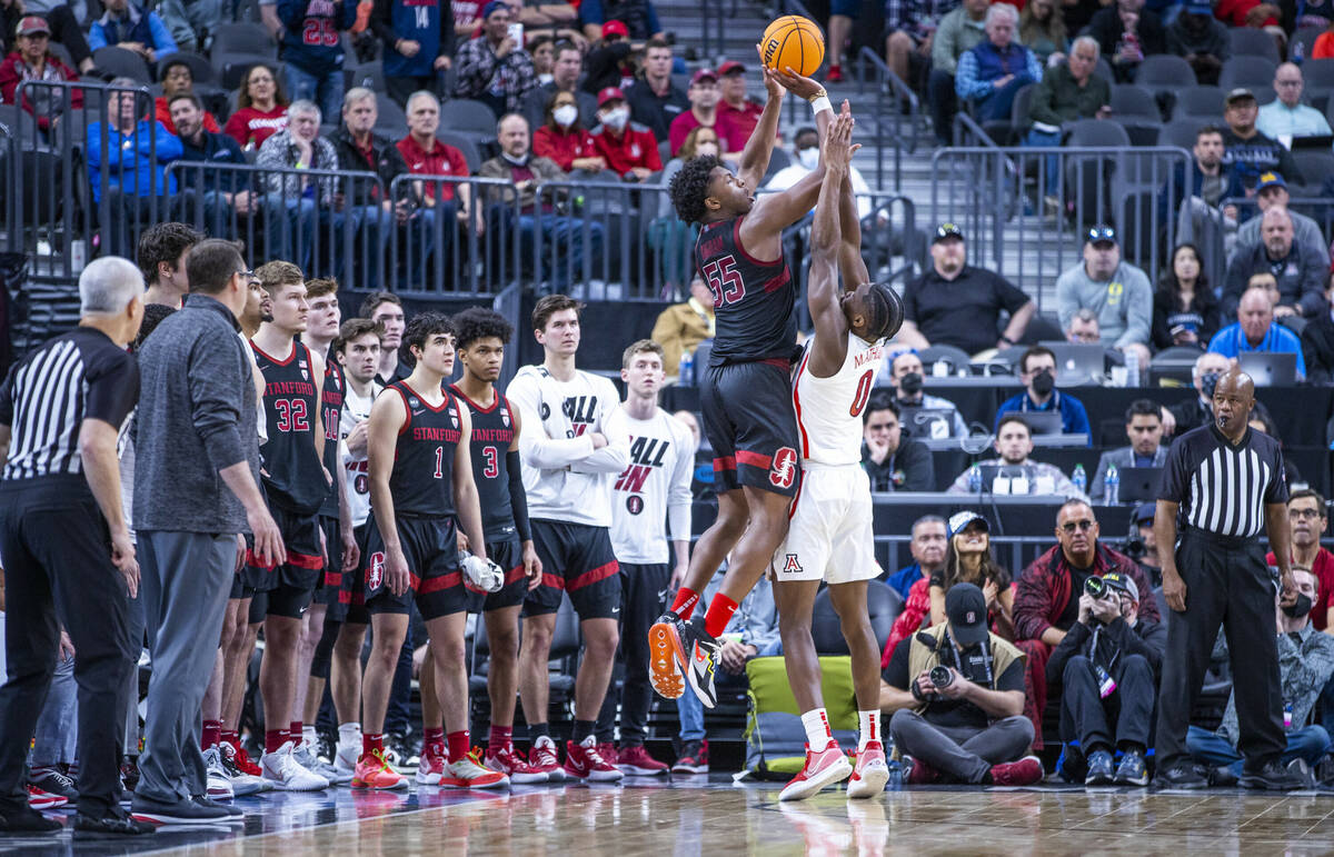 The team watches as Stanford Cardinal forward Harrison Ingram (55) makes a three-point basket o ...