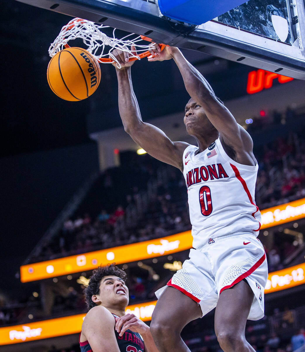 Arizona Wildcats guard Bennedict Mathurin (0) dunks late in the game over Stanford Cardinal for ...