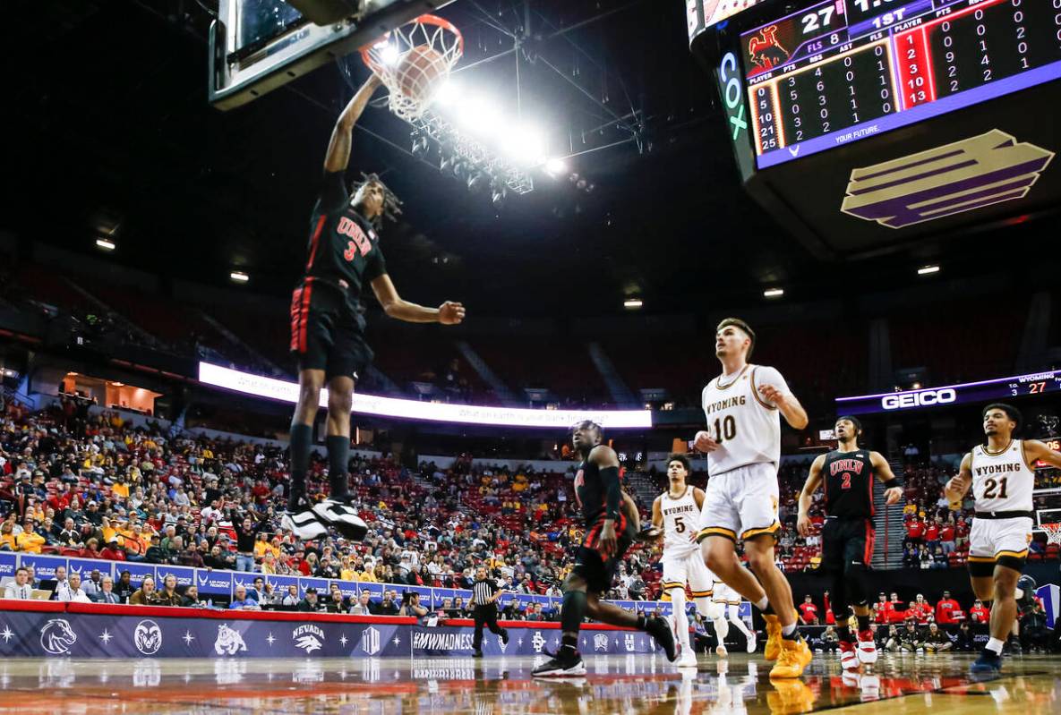UNLV Rebels forward Donovan Williams (3) dunks the ball against the Wyoming Cowboys during the ...