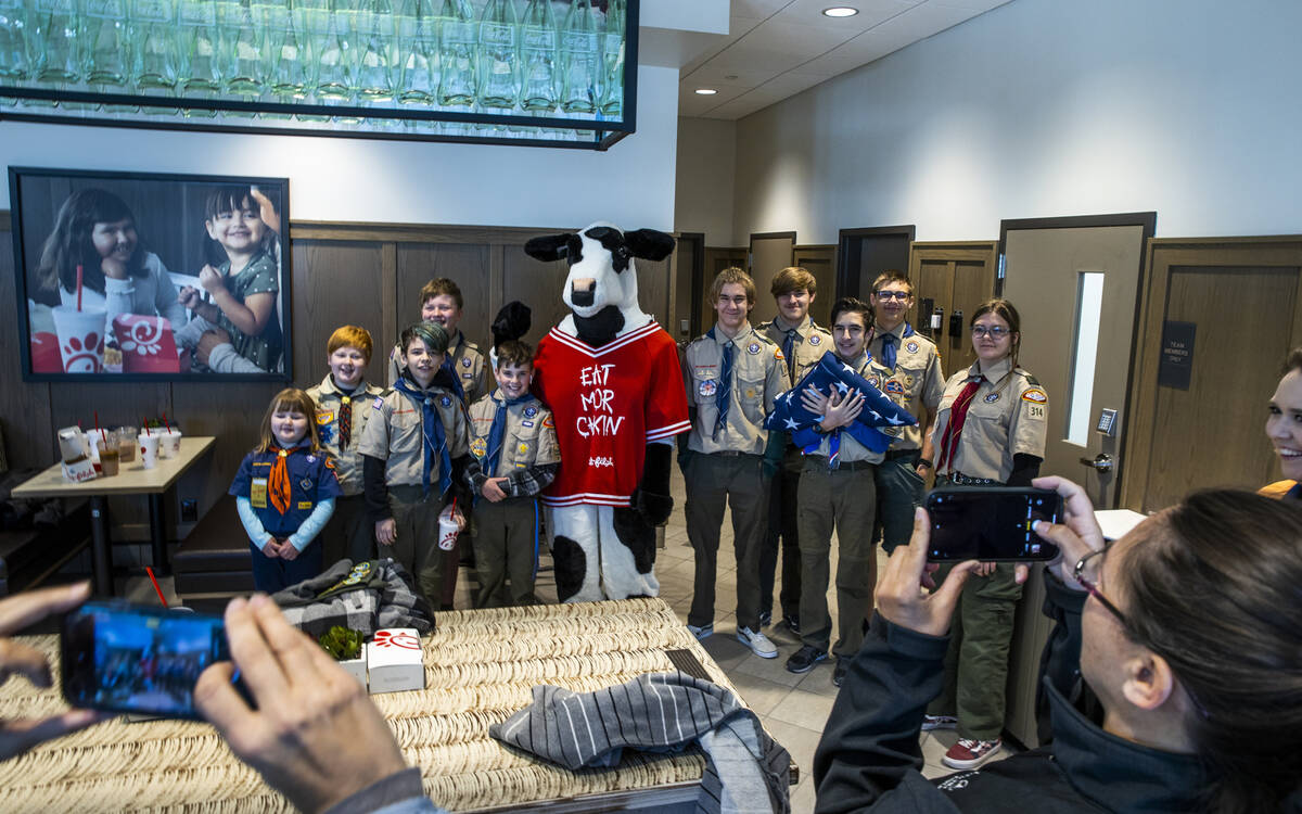 Boy Scout Troop 314 members are on hand as the new Chick-Fil-A opens complete with a ribbon cut ...