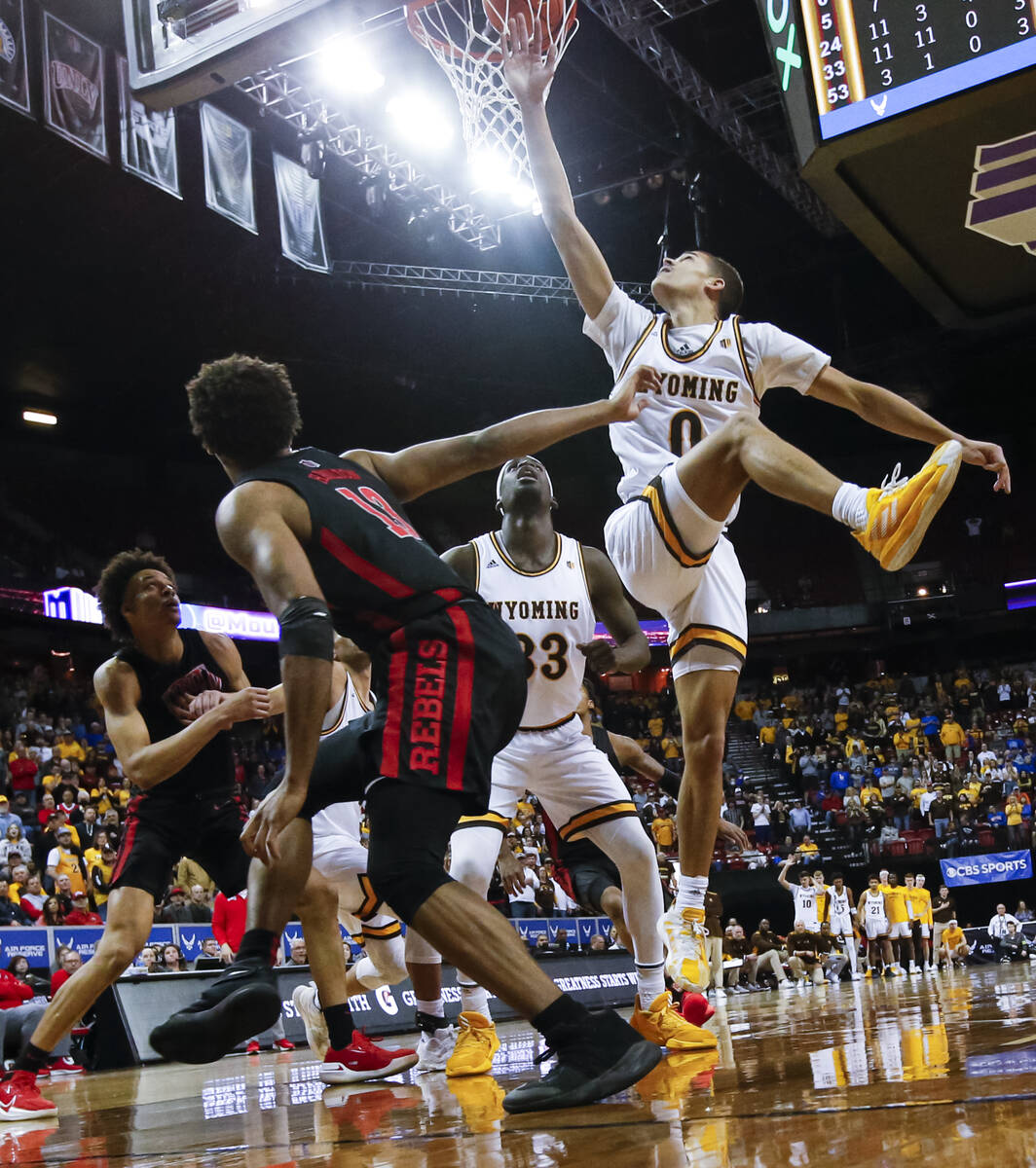 UNLV Rebels guard Bryce Hamilton (13) watches his shot go in against the Wyoming Cowboys during ...