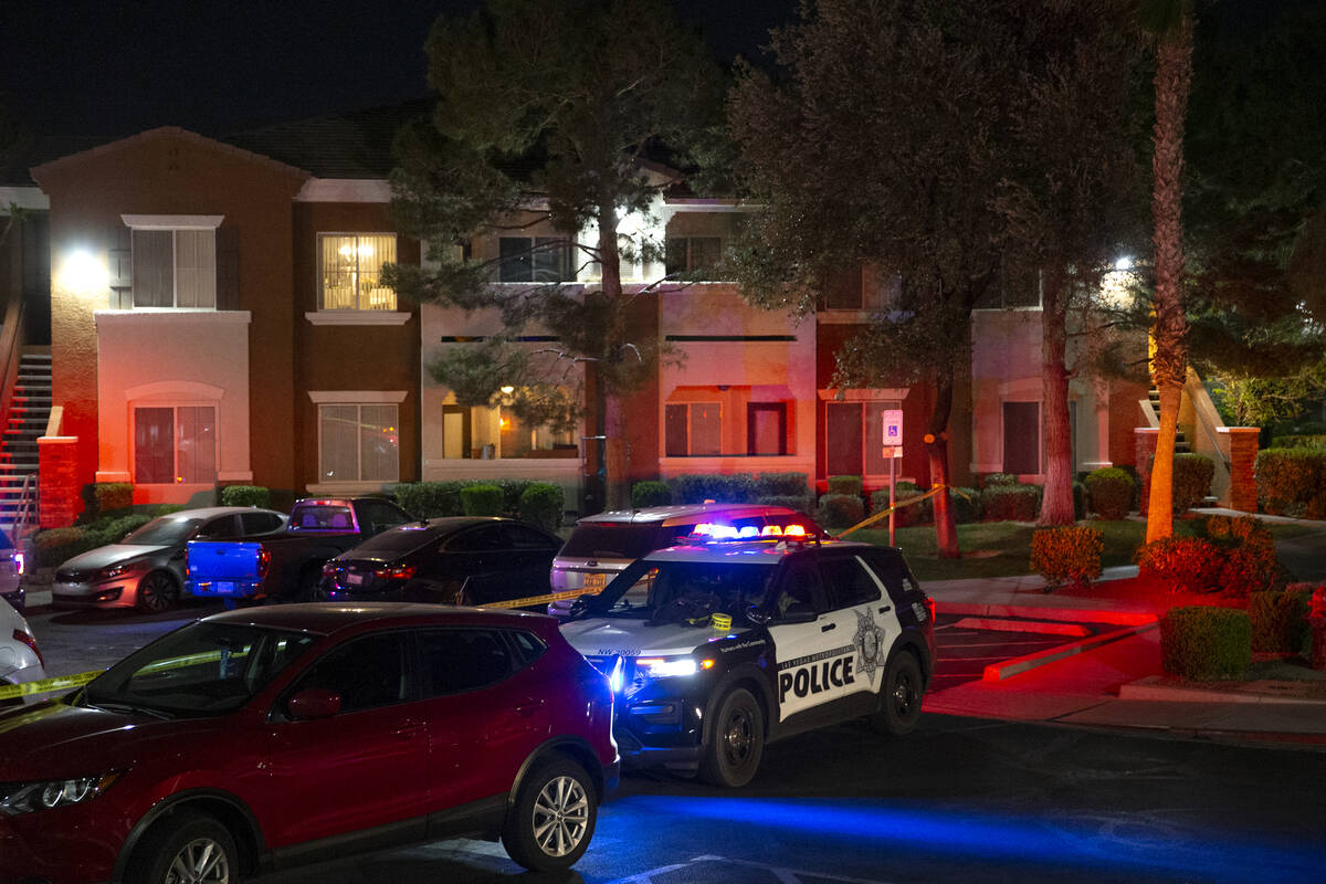Metropolitan police investigate a homicide at a gated apartment complex in the 9300 block of Gi ...