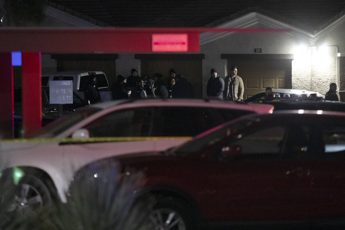 Metropolitan police investigate a homicide at a gated apartment complex in the 9300 block of Gi ...