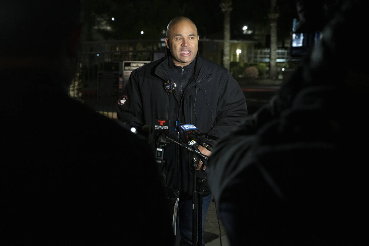 Lt. Ray Spencer gives a briefing to the media on the investigation of a homicide at a gated apa ...