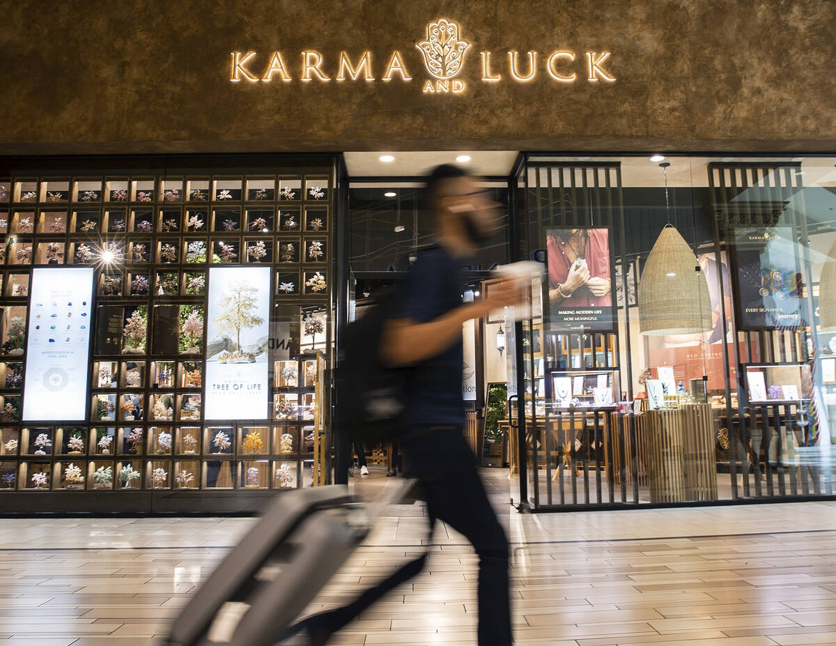 A tourist walks past Karma and Luck retail store on Thursday Feb. 10, 2022, in Las Vegas. Las V ...
