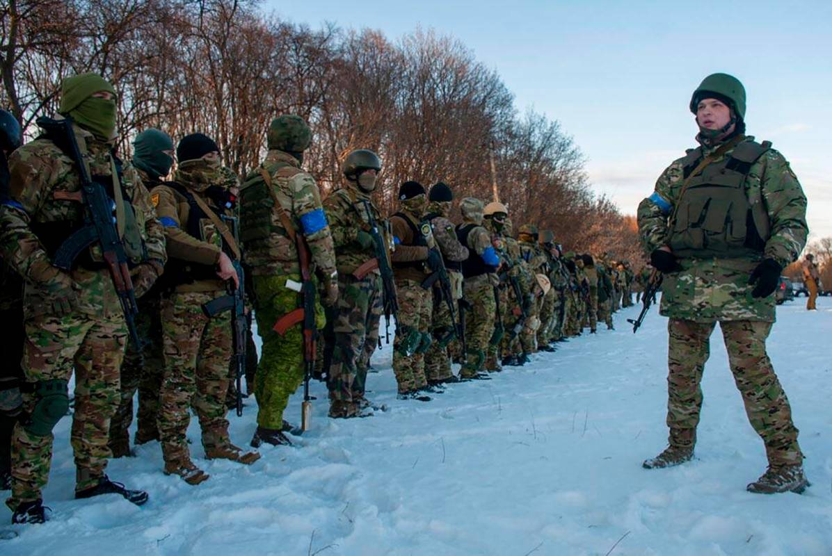 Ukrainian servicemen attend a training session outside Kharkiv, Ukraine, Friday, March 11, 2022 ...