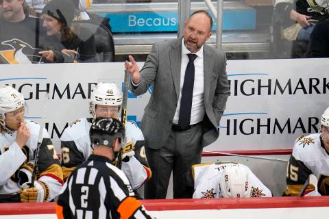 Vegas Golden Knights head coach Peter DeBoer has a word with referee Jon McIsaac (2) during the ...