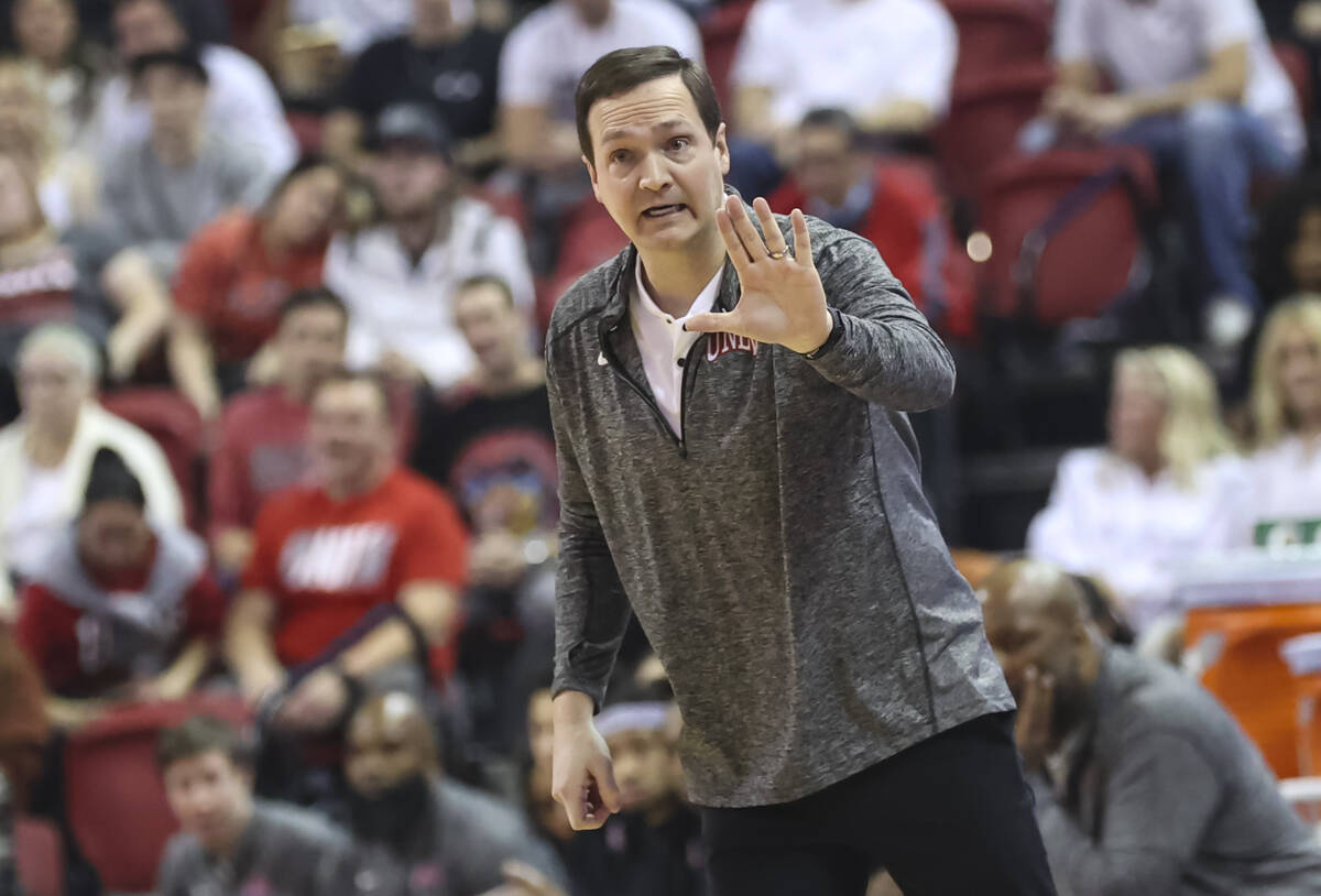 UNLV Rebels head coach Kevin Kruger motions to his team during the first half of a basketball g ...