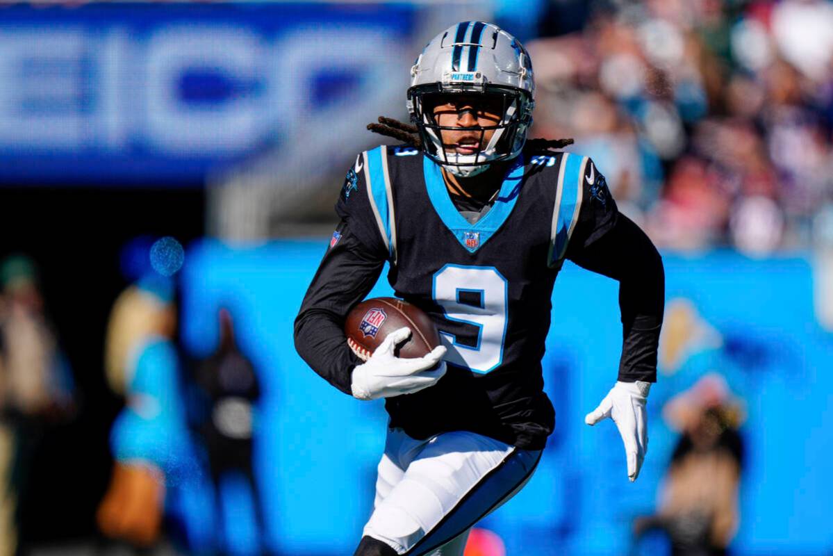 Carolina Panthers' Stephon Gilmore returns an interception against the New England Patriots dur ...