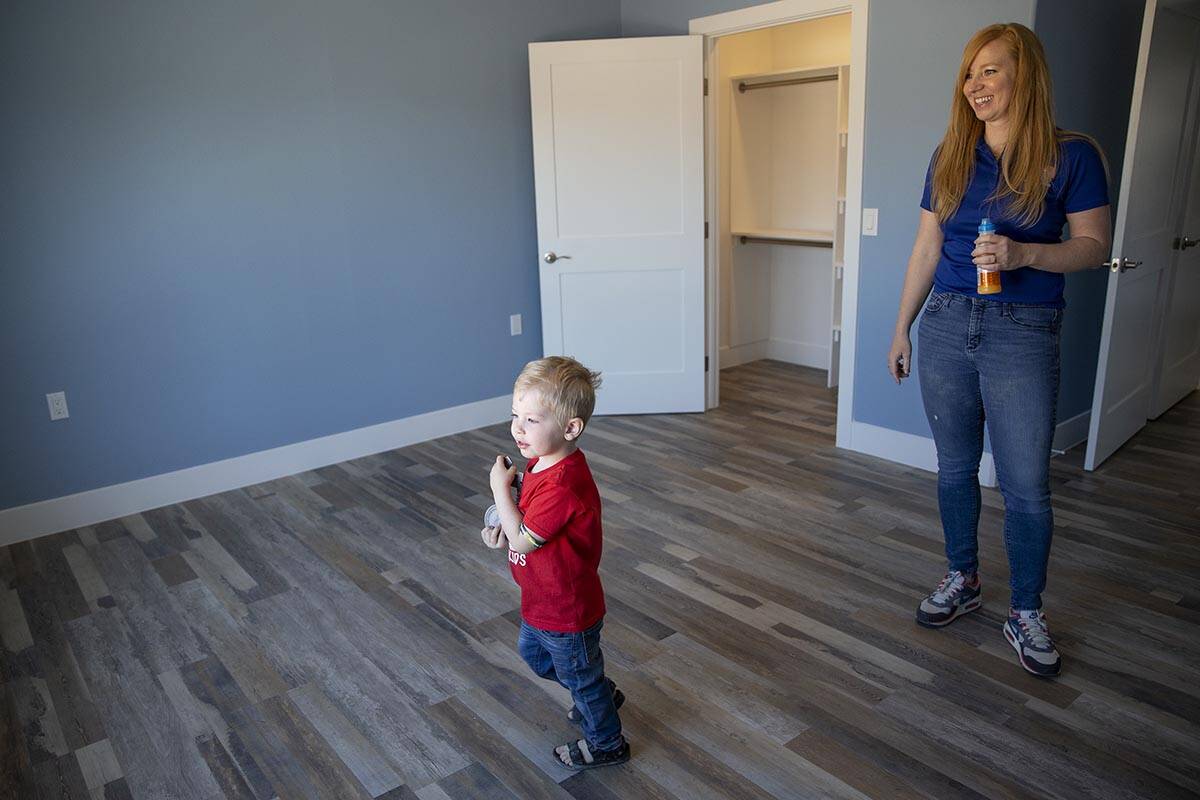 Senna Poppenhouse, 3, sees his new room with his mother Megan Poppenhouse on Saturday, March 12 ...