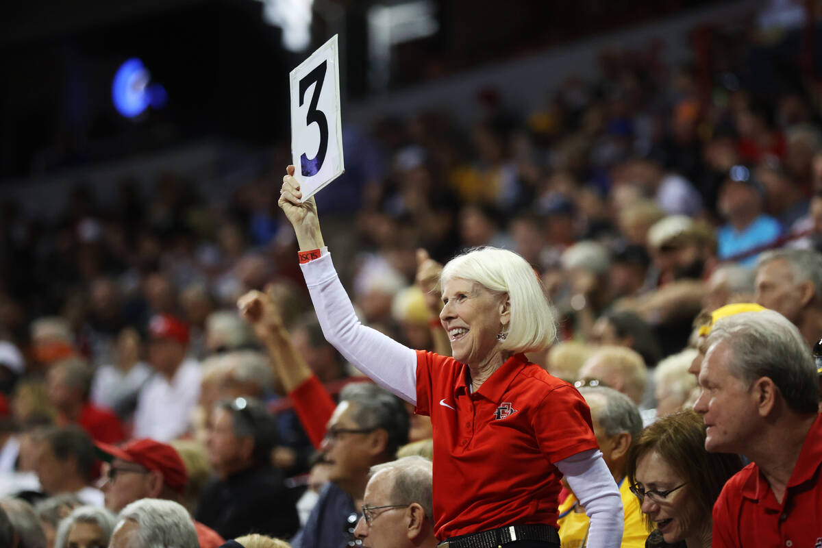 A fan cheers during the second half of the Mountain West Conference Men's Basketball Tournament ...