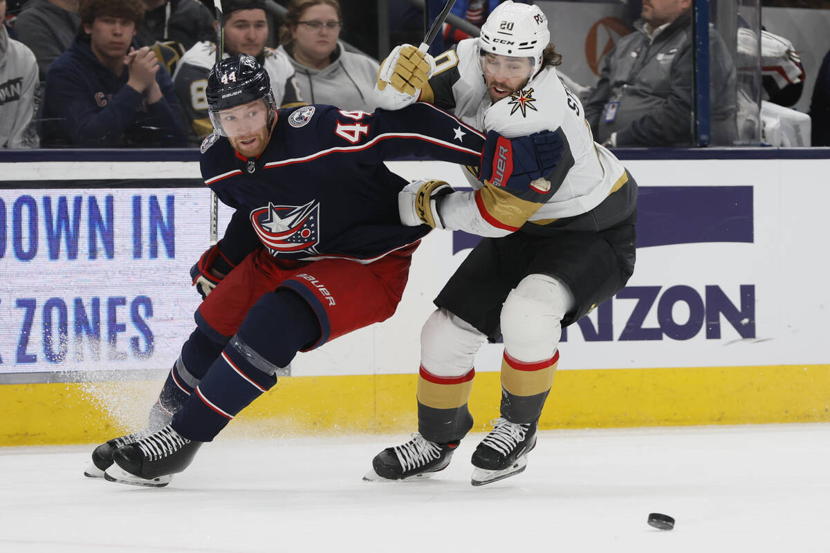 Columbus Blue Jackets' Vladislav Gavrikov, left, and Vegas Golden Knights' Chandler Stephenson ...