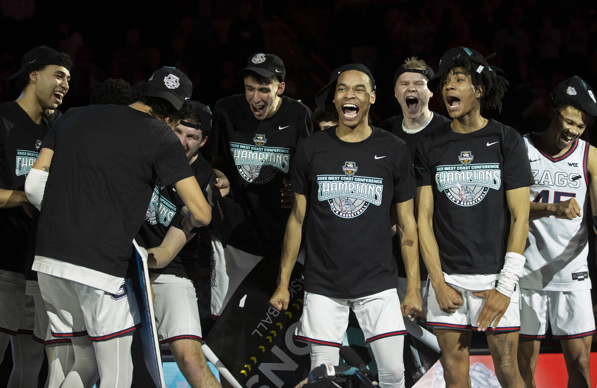 Gonzaga players celebrate after beating St. Mary’s to win the West Coast Conference tour ...