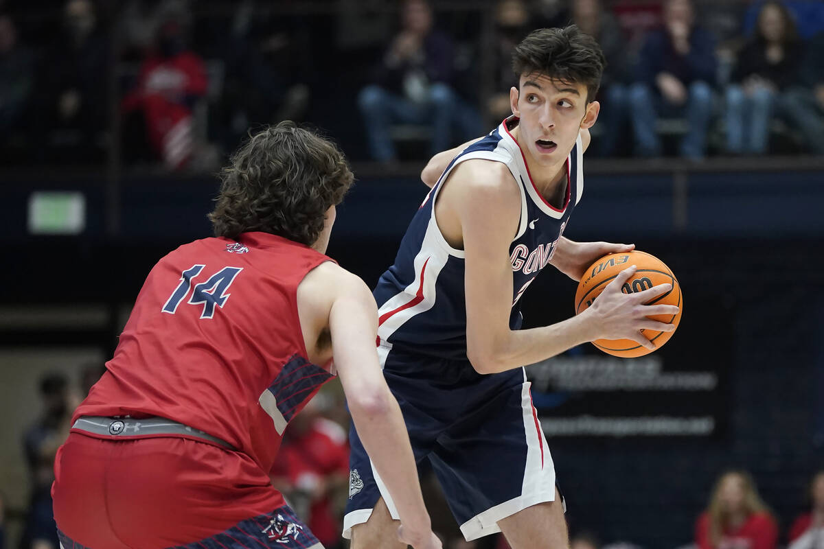 Gonzaga center Chet Holmgren, right, is defended by Saint Mary's forward Kyle Bowen during the ...