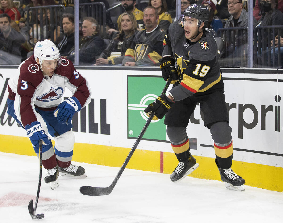 Golden Knights right wing Reilly Smith (19) makes a pass around Colorado Avalanche defenseman J ...