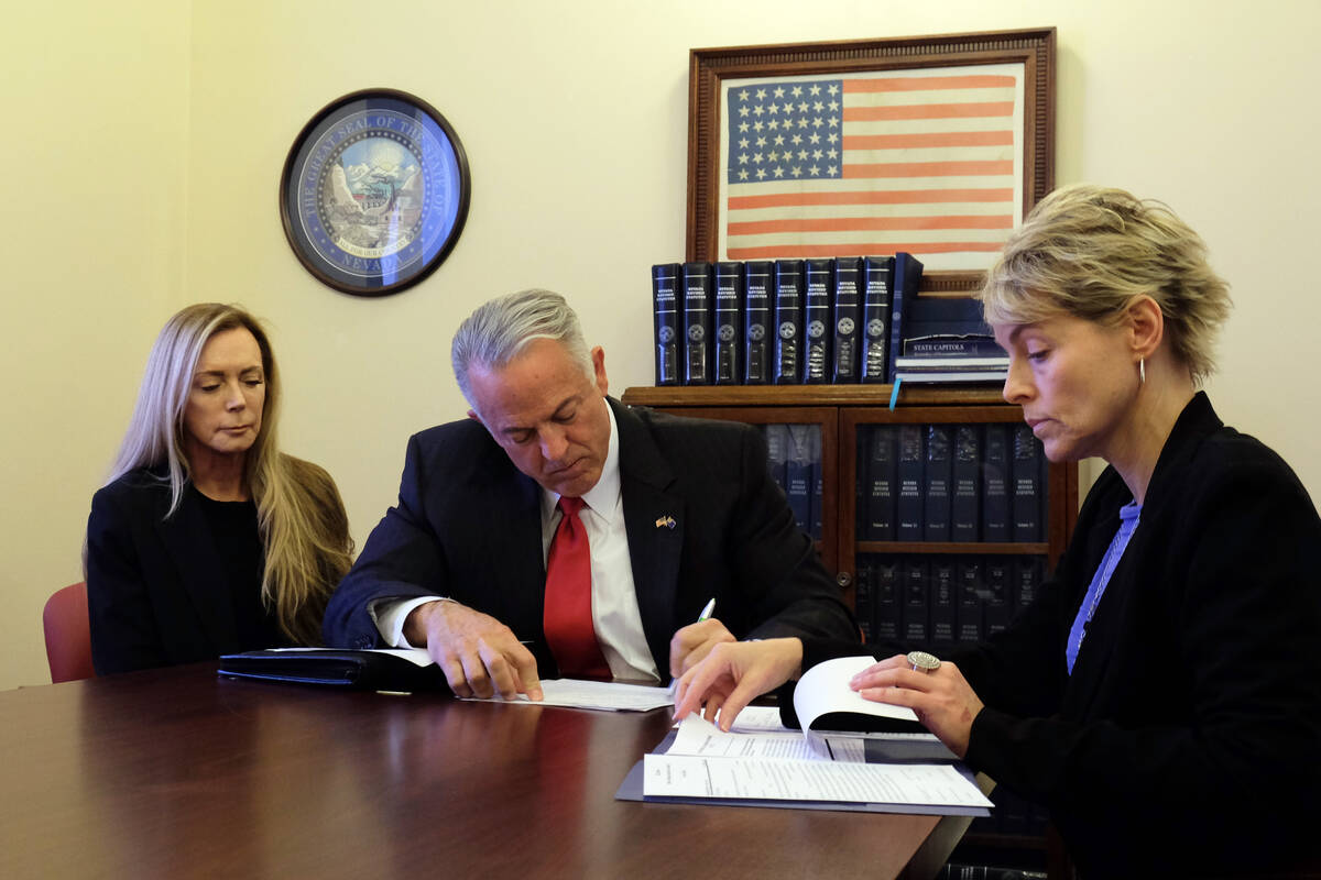 Clark County Sheriff Joe Lombardo filling out paperwork in the Secretary of State's office Mond ...