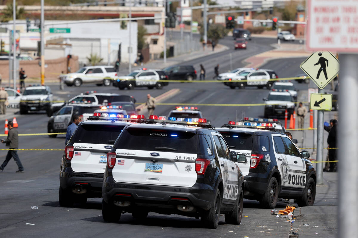 Las Vegas police investigate an officer-involved shooting on North Main Street at Foremaster La ...