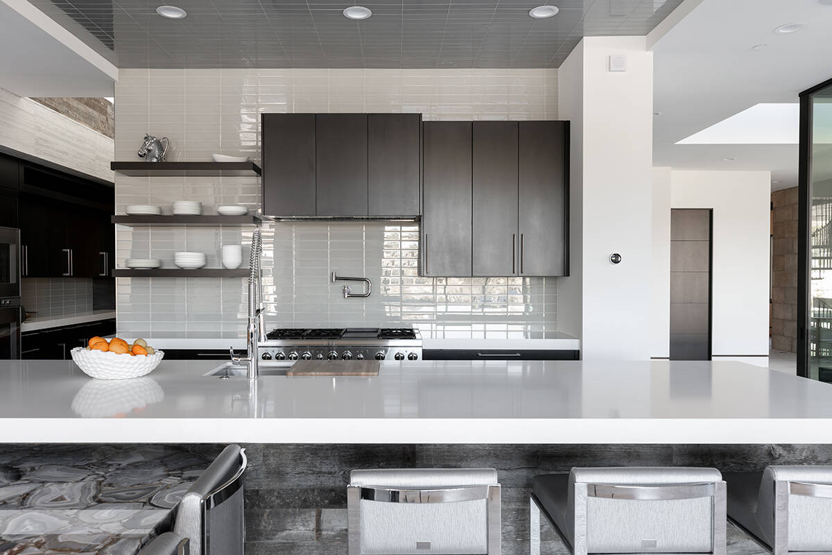 A kitchen island provides seating. (Ivan Sher Group)