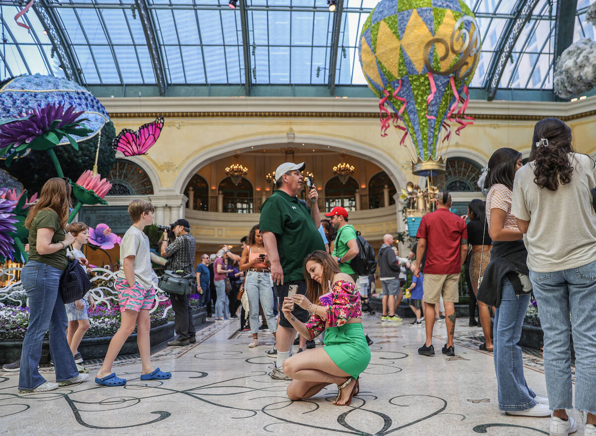 Visitors enjoy the new spring display “Flights of Fancy” at the Bellagio Conserva ...